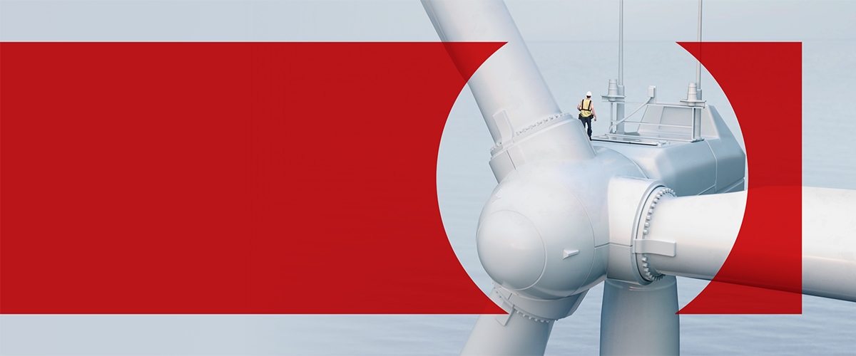 Man walking on large windmill