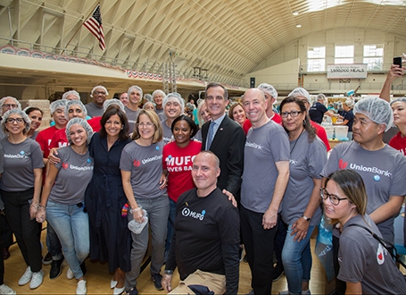 Image of bank employees working in the community
