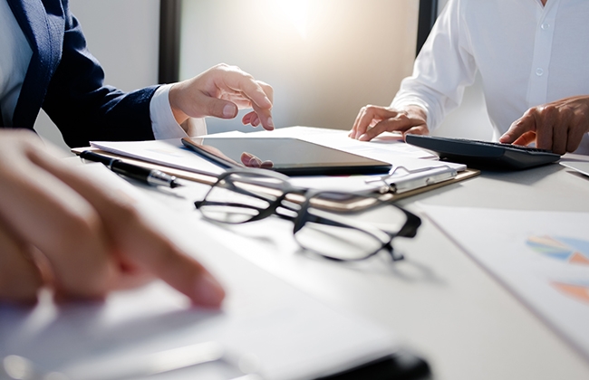 Photo of people doing paperwork