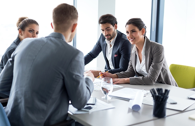 Four people in a meeting