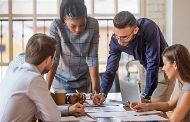 Four people working together