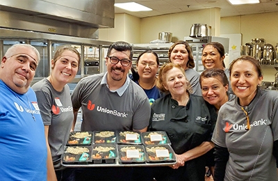 Employees with a food tray