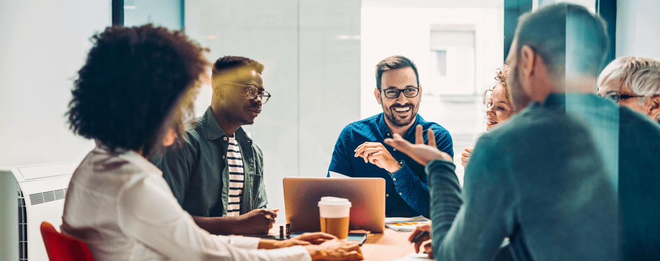 Employees at a conference table