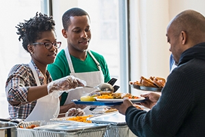 Volunteers serving food