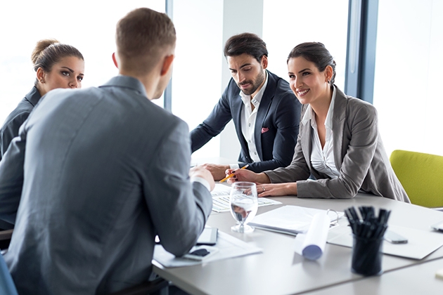Four people in a meeting