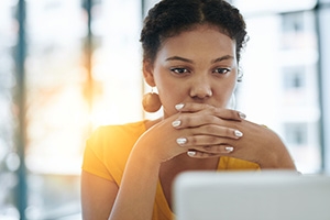 Woman looking at laptop