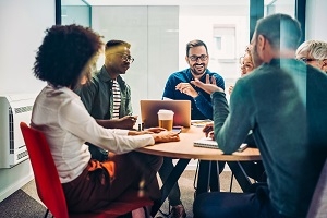 Group of employees talking at a table